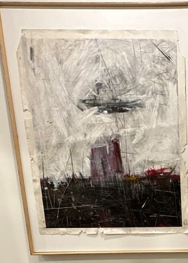 An abstract work: a scored white ground weighted by a low band of black, with a single red mark surfacing through it.